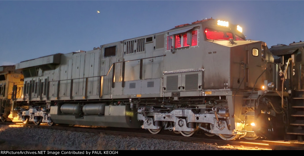 The Red Light District of BNSF 3283 As Night Has Fallen at Wabtec.